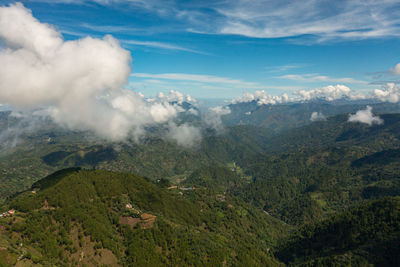 Aerial drone of mountain slopes covered with rainforest and jungle view from above. philippines.