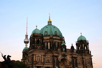 Low angle view of berlin cathedral against sky in city at dusk