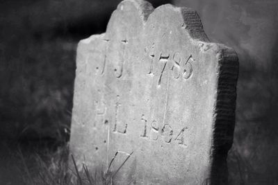 Close-up of text on cemetery