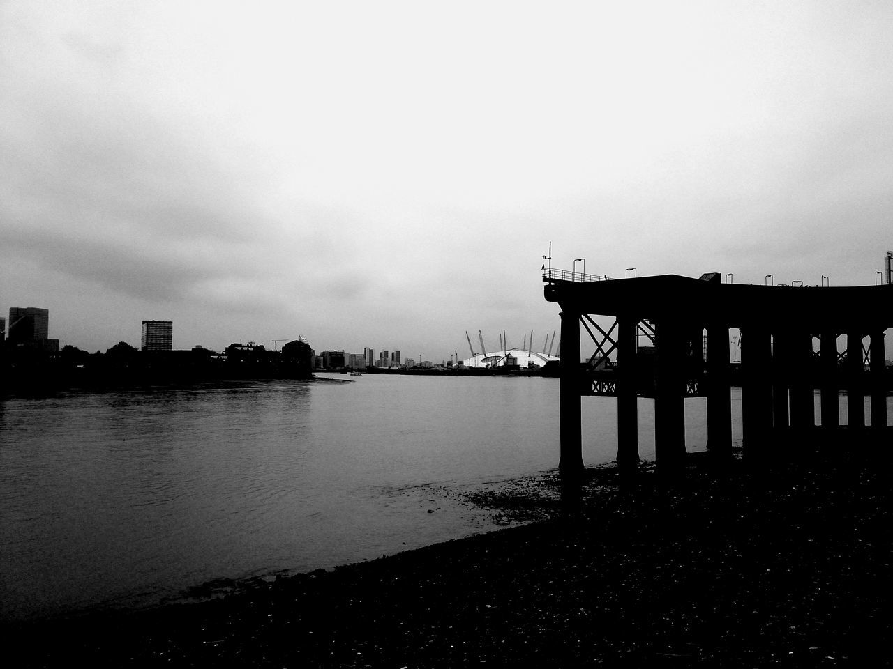 water, built structure, architecture, sky, building exterior, reflection, river, silhouette, dusk, waterfront, sea, cloud - sky, lake, sunset, tranquility, pier, city, nature, outdoors, no people