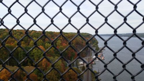 Full frame shot of chainlink fence against sky