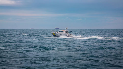 Military motorboat sailing in sea