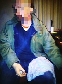 Close-up of cat relaxing on the wall