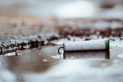 Close-up of cigarette on wall