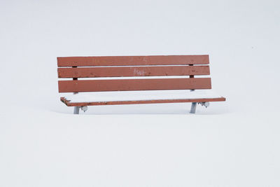 Empty bench on snow