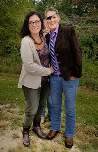 Full length portrait of happy friends standing on land