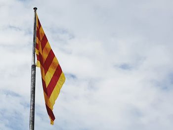 Low angle view of catalonian flag against sky