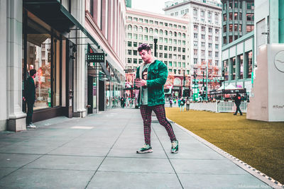 Man standing on street in city