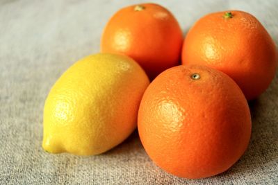 Close-up of citrus fruits on table