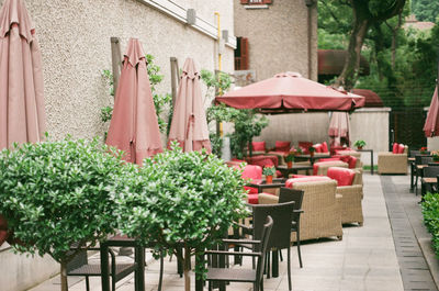 Tables and chairs arranged in open restaurant