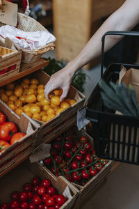 Man in shop choosing tomatoes