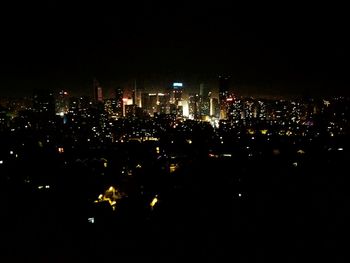 Illuminated cityscape at night