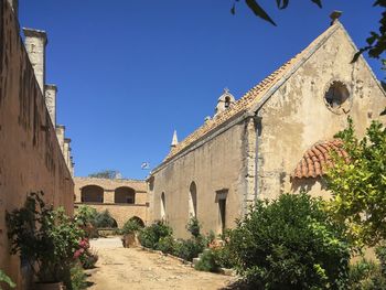 Exterior of historic building against clear blue sky