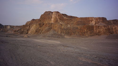 Rock formations in desert against sky