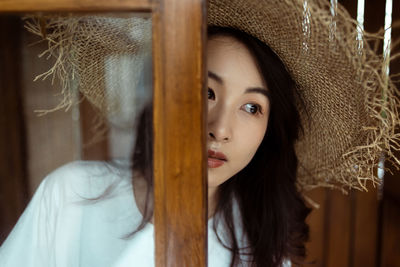 Portrait of young woman looking away