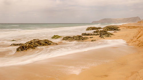 Scenic view of beach against sky