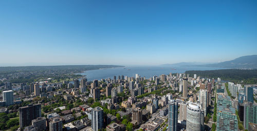 High angle view of modern buildings in city against clear sky