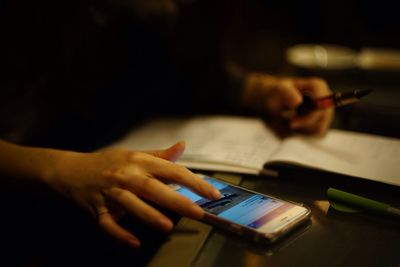 Close-up of woman using mobile phone