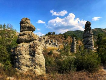 Low angle view of rocks against sky