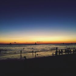 Scenic view of beach against sky during sunset