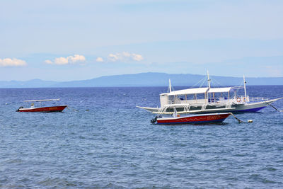 Boat on sea against sky