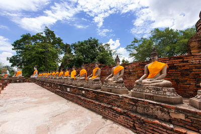 Statue of temple against cloudy sky