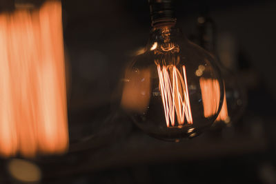 Close-up of illuminated light bulb