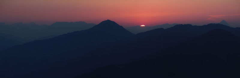 Silhouette mountain range against the sky