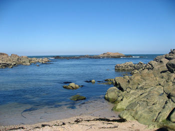 Scenic view of sea against clear blue sky