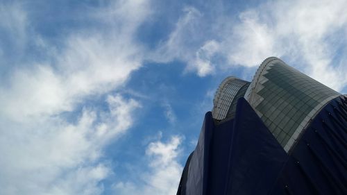 Low angle view of building against cloudy sky