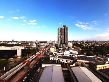 High angle view of buildings in city against sky