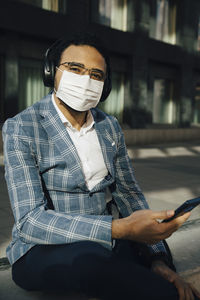 Portrait of businessman with face mask