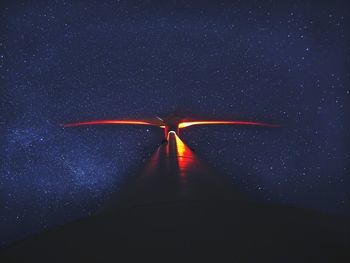 Light trails against sky at night