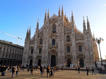 Group of people in front of milan cathedral