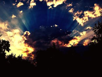 Low angle view of cloudy sky at sunset