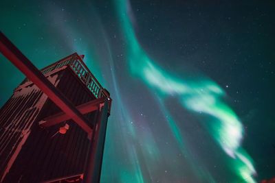 Aurora borealis and old industrial building