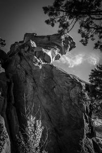 Low angle view of rock formation against sky