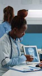 Side view of doctor working at clinic