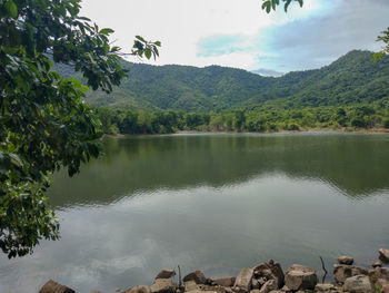 Scenic view of lake and mountains against sky