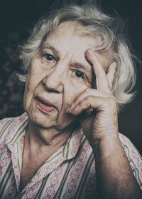 Close-up portrait of senior woman at home