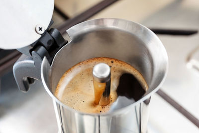 High angle view of coffee maker on table