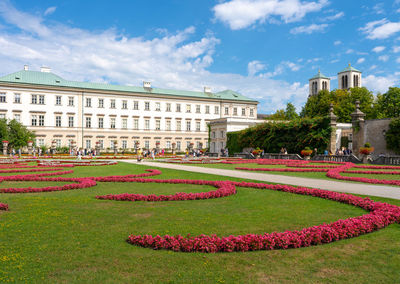 Building in garden against sky