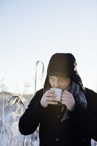 Portrait of a man with a cup