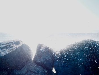 Scenic view of sea against clear sky during winter