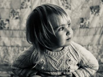 Portrait of cute boy looking away outdoors