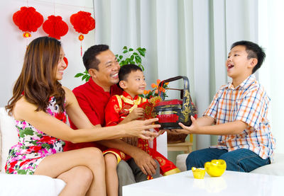 Happy family enjoying at home during festival