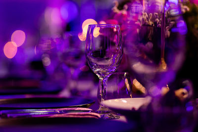 Luxury table settings for fine dining with and glassware, pouring wine to glass.