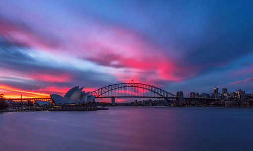 View of bridge over sea at sunset