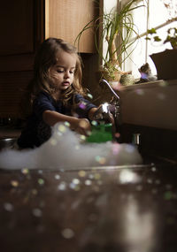 Girl looking at camera at home