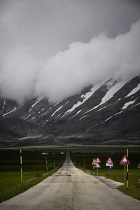 Road amidst landscape against sky